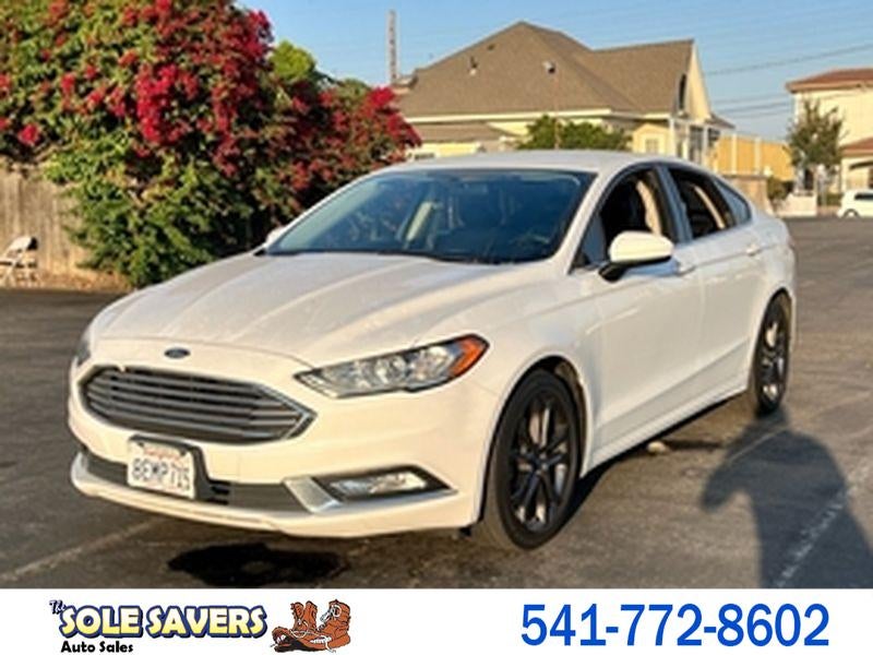 2018 Ford Fusion SE in White — front three-quarter view