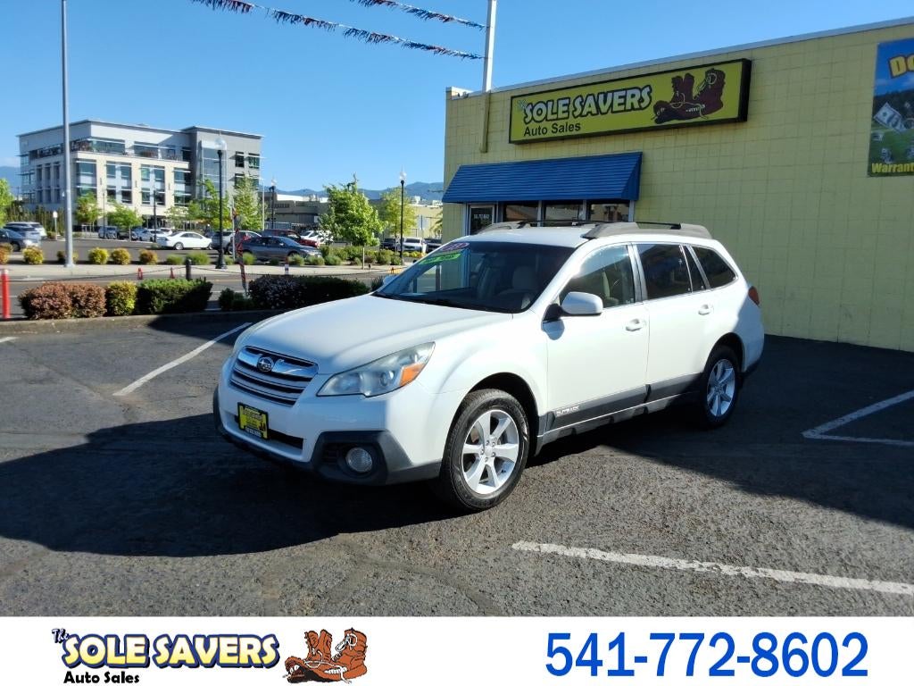 2013 Subaru Outback Premium in White — front three-quarter view
