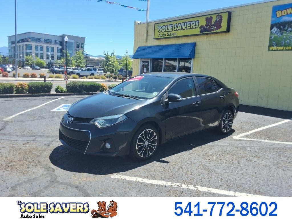 2015 Toyota Corolla 4dr Sdn Auto L (Natl) in Black — front three-quarter view